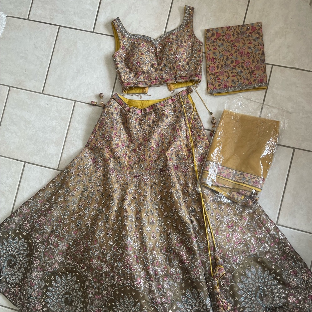 Boutique golden peacock lengha